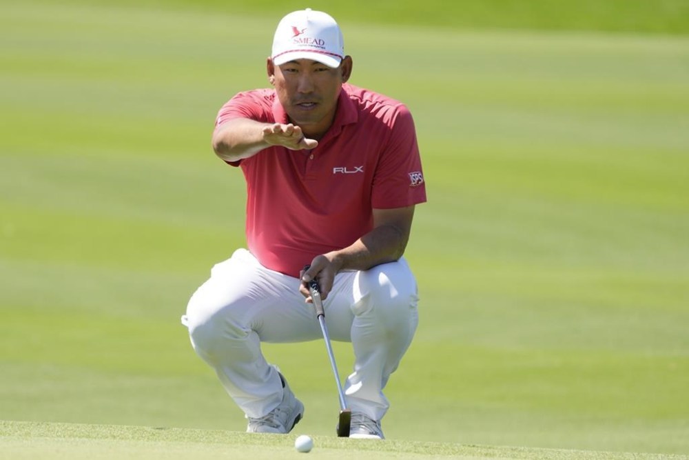 Chan Kim, of the United States, studies his putt at the first green during the third round of the Mexico Open golf tournament in Puerto Vallarta, Mexico, Saturday, Feb. 24, 2024. (AP Photo/Fernando Llano)