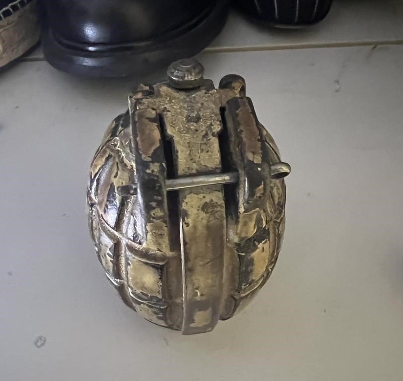 A decommissioned grenade is shown in this undated handout photo from Abbotsford Police, who say the grenade was found in a thrift store donation bin on Monday, Feb. 26, 2024. THE CANADIAN PRESS/HO, Abbotsford Police *MANDATORY CREDIT*