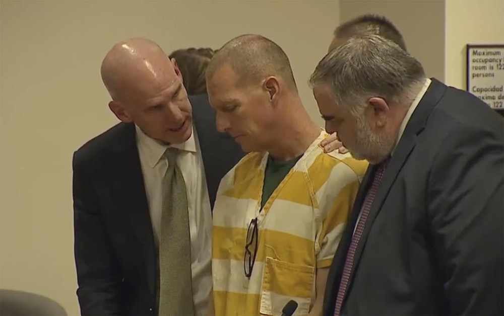 Lawyers console Paramedic Peter Cichuniec after his sentence is read on Friday, March 1, 2024 in Brighton, Colo. Cichuniec was sentenced to five years in prison for the death of Elijah McClain in a rare prosecution of medical responders that has left officials rethinking how they treat people in police custody.(Colorado State Court via AP, POOL)