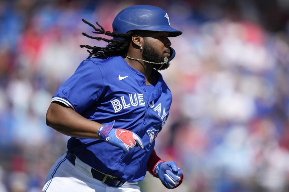 Toronto Blue Jays' Vladimir Guerrero Jr. watches a fly ball in the fourth inning of a spring training baseball game against the Philadelphia Phillies Monday, March 4, 2024, in Dunedin, Fla. THE CANADIAN PRESS/AP, Charlie Neibergall