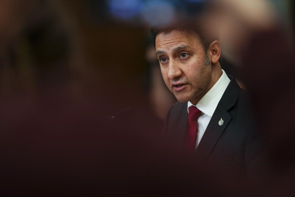Justice Minister Arif Virani holds a press conference on the new online harms bill on Parliament Hill in Ottawa on Monday, Feb. 26, 2024. Government officials say online hate speech would have to portray a group as