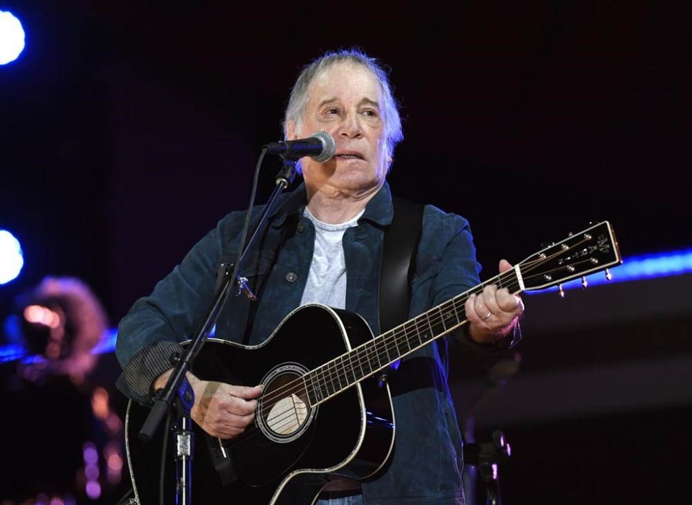 FILE - Paul Simon performs at Global Citizen Live in Central Park in New York on Sept. 25, 2021. Simon's latest honor places him among public figures well outside the music industry. He is this year's winner of PEN America's PEN/Audible Literary Service Award, Thursday, March 7, 2024, which previously has been given to former President Barack Obama, the late Nobel laureate Toni Morrison and Stephen King among others.(Photo by Evan Agostini/Invision/AP, File)
