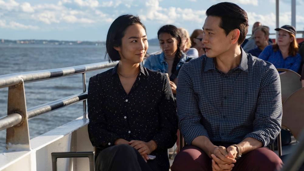 Greta Lee (left) and Teo Yoo are shown in a scene from