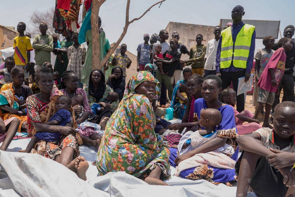 South Sudanese who fled from Sudan sit outside a nutrition clinic at a transit center in Renk, South Sudan last year. (File)