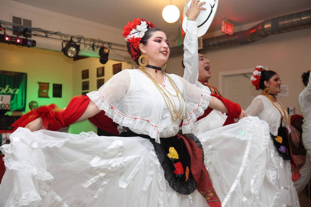 Dancers with Rey Vels from Cancun perform for visitors to the Mexico pavilion in the Brandon Shrine Club on Friday evening.