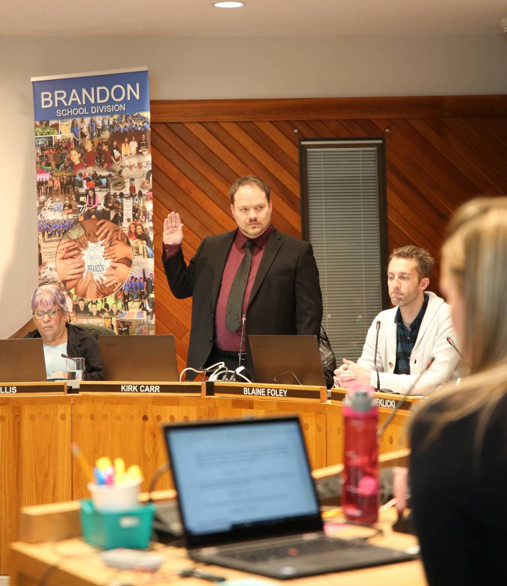 Kirk Carr, shown being sworn in as Ward 1 school trustee after last fall's byelection, will take part in his first budget deliberation as a trustee next week. (File)