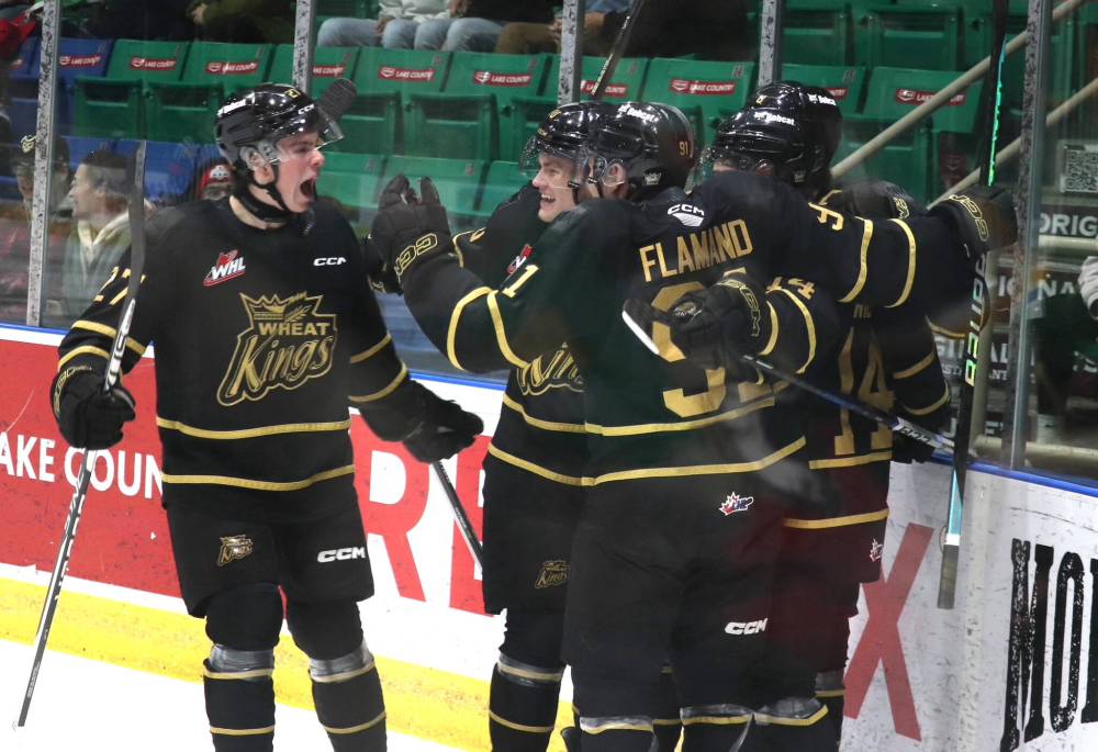 Brandon Wheat Kings defenceman Luke Shipley (27), left to right, joins teammates Caleb Hadland (10), Nolan Flamand (91) goal scorer Jayden Wiens (14) and Quinn Mantei (8, obscured in the background) after they scored 26 seconds into their Western Hockey League game against the Prince Albert Raiders at the Art Hauser Centre on Thursday evening. (Nathan Reiter/Prince Albert Daily Herald)