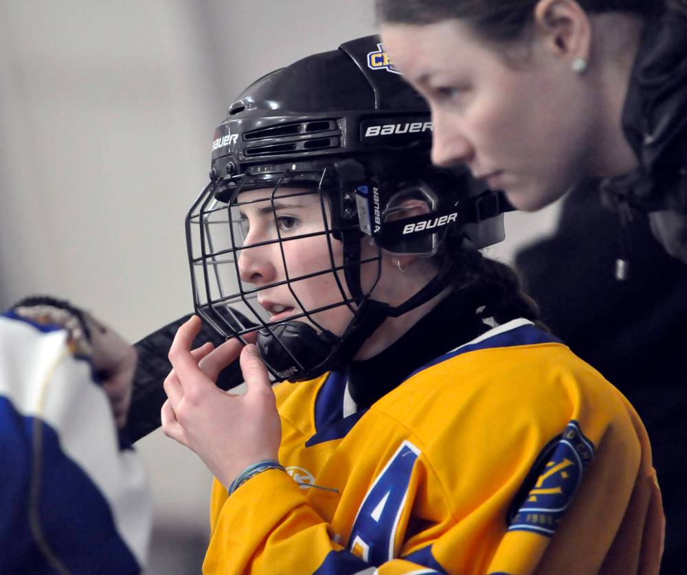 An assistant captain on the Yellowhead Chiefs this season, forward Mia McGregor listens to strategy on the bench from assistant captain Cass Lyttle during her team's 4-1 win during the final game of the 2023-24 season hosting the Winnipeg Avros in Shoal Lake. (Jules Xavier/The Brandon Sun)