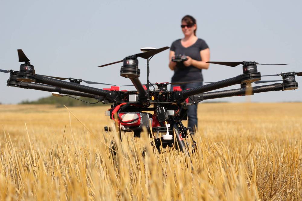 Danielle Tichit, instructor in Assiniboine Community College’s Ag and Sustainable Food Systems program, uses a drone in a crop field as part of the program's hands-on learning. (Submitted)