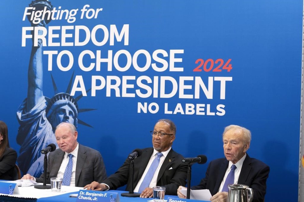 FILE - No Labels leadership and guests from left, Dan Webb, National Co-Chair Dr. Benjamin F. Chavis, and founding Chairman and former Sen. Joe Lieberman, speak about the 2024 election at National Press Club, in Washington, Jan. 18, 2024. The third-party presidential movement No Labels is expected to move this week toward fielding a presidential candidate in the November election. (AP Photo/Jose Luis Magana, File)