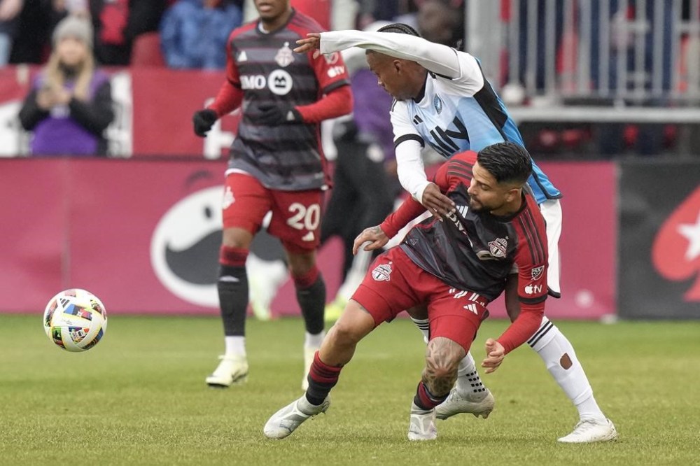 Toronto FC's Lorenzo Insigne, right, battles for the ball with Charlotte FC's Kerwin Vargas during first half MLS action in Toronto, Saturday, March 9, 2024. THE CANADIAN PRESS/Chris Young