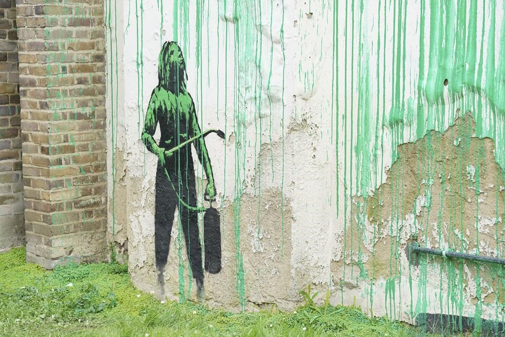 A new Banksy mural sprouts beside a cropped tree in London. Many