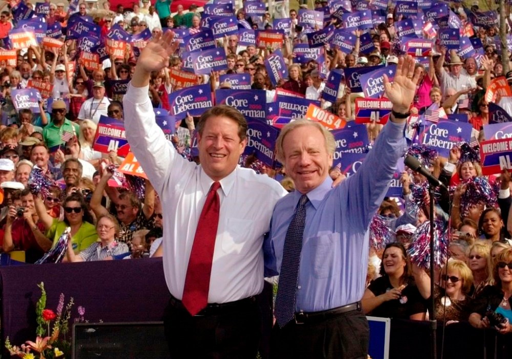 FILE - Democratic presidential candidate Vice President Al Gore, left, and his running mate, vice presidential candidate Sen. Joe Lieberman, of Connecticut, wave to supporters at a campaign rally in Jackson, Tenn., Oct. 25, 2000. Lieberman, who nearly won the vice presidency on the Democratic ticket with Gore in the disputed 2000 election and who almost became Republican John McCain's running mate eight years later, has died Wednesday, March 27, according to a statement issued by his family. He was 82. (AP Photo/Stephan Savoia, File)