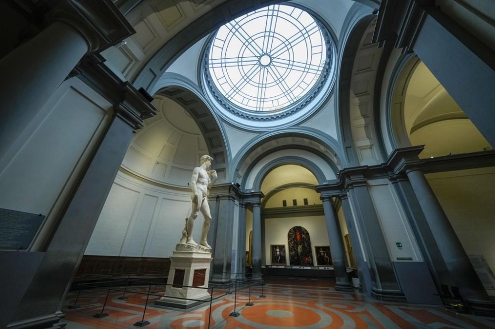 Michelangelo's 16th century statue of David is seen on display at the Accademia gallery, in Florence, central Italy, Monday, March 18, 2024. Michelangelo’s David has been a towering figure in Italian culture since its completion in 1504. But curators worry the marble statue’s religious and political significance is being diminished by the thousands of refrigerator magnets and other souvenirs focusing on David’s genitalia. The Galleria dell’Accademia’s director has positioned herself as David’s defender and takes swift aim at those profiteering from his image. (AP Photo/Andrew Medichini)