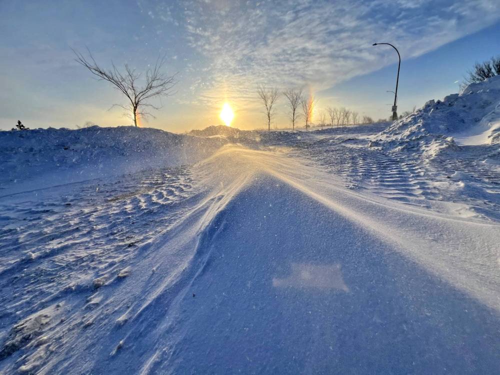Blowing snow covers the road into the Riverbank Discovery Centre on Monday morning. (Matt Goerzen/The Brandon Sun).