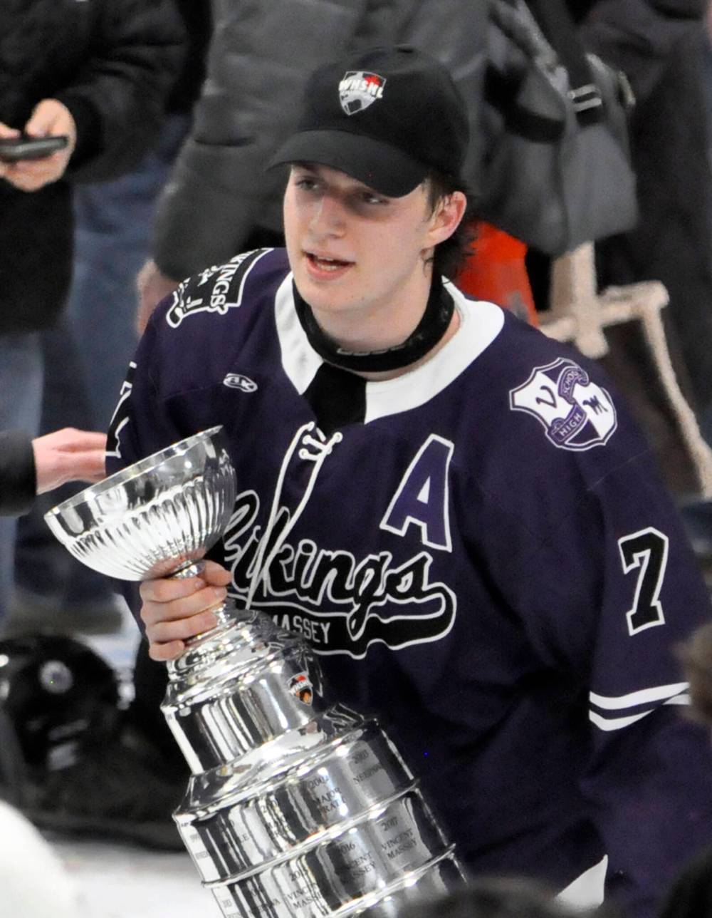Vincent Massey Vikings sniper Carter Dittmer, who led the WHSHL in scoring during the 2023-24 season, clutches the championship trophy Wednesday night while looking for family to share it with on the ice in Neepawa. (Jules Xavier/The Brandon Sun)