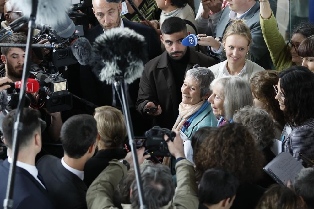 Swiss members of Senior Women for Climate Protection answer reporters after the European Court of Human Rights ruling, Tuesday, April 9, 2024 in Strasbourg, eastern France. Europe's highest human rights court ruled that its member nations have an obligation to protect their citizens from the ill effects of climate change, but still threw out a high-profile case brought by six Portuguese youngsters aimed at forcing countries to reduce greenhouse gas emissions. (AP Photo/Jean-Francois Badias)