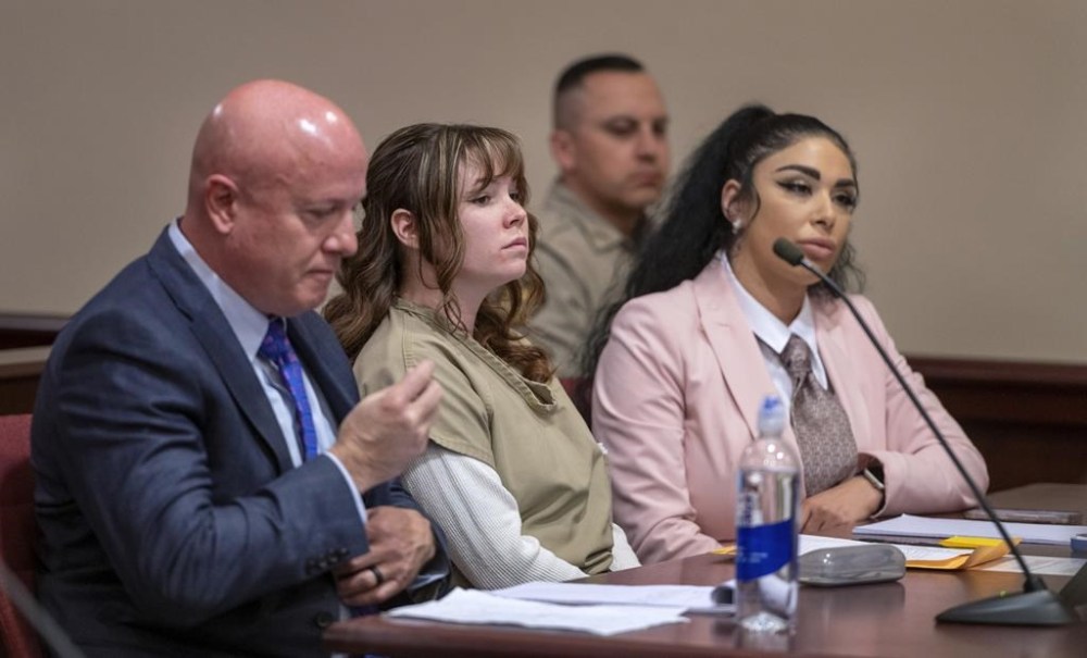 Hannah Gutierrez-Reed, center, with her attorney Jason Bowles, left, and paralegal Carmella Sisneros prepare for a sentencing hearing in state district court in Santa Fe, N.M., on Monday April 15, 2024. Gutierrez-Reed, the armorer on the set of the Western film