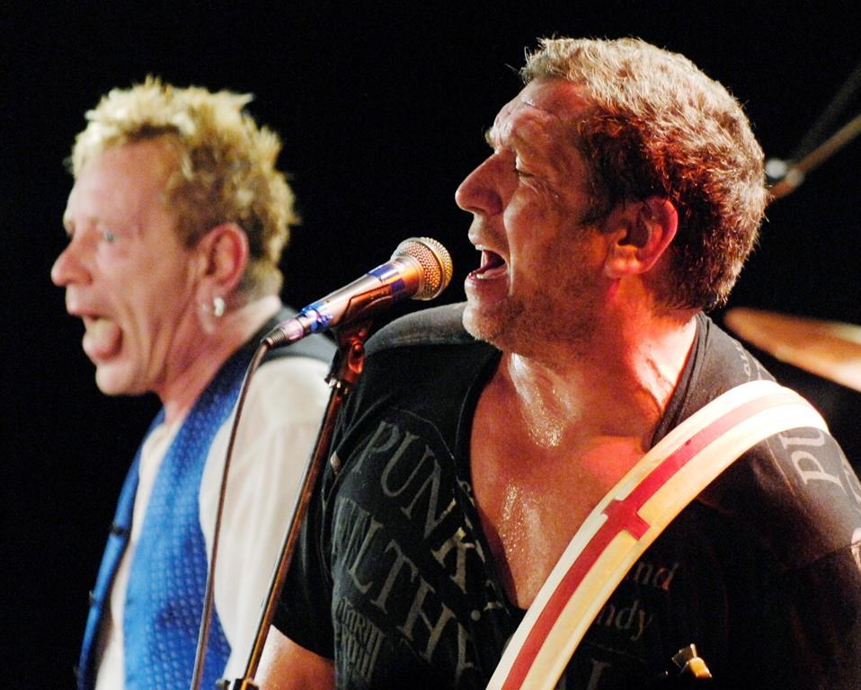A woman has filed a civil lawsuit against Paramount Pictures Corp. and a guitarist of the British punk rock band the Sex Pistols, claiming the musician sexually assaulted her while theywere working on a movie in Vancouver in 1980. Steve Jones, right, and John Lydon of The Sex Pistols perform at the Roxy in West Hollywood, Calif., Thursday, Oct. 25, 2007. THE CANADIAN PRESS/AP-Invision, Chris Pizzello