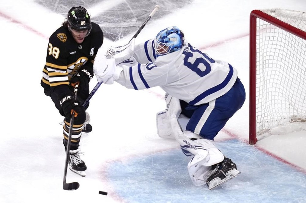 Toronto Maple Leafs goaltender Joseph Woll (60) stops Boston Bruins right wing David Pastrnak (88) during the third period of Game 5 of an NHL hockey Stanley Cup first-round playoff series, Tuesday, April 30, 2024, in Boston. THE CANADIAN PRESS/AP/Charles Krupa