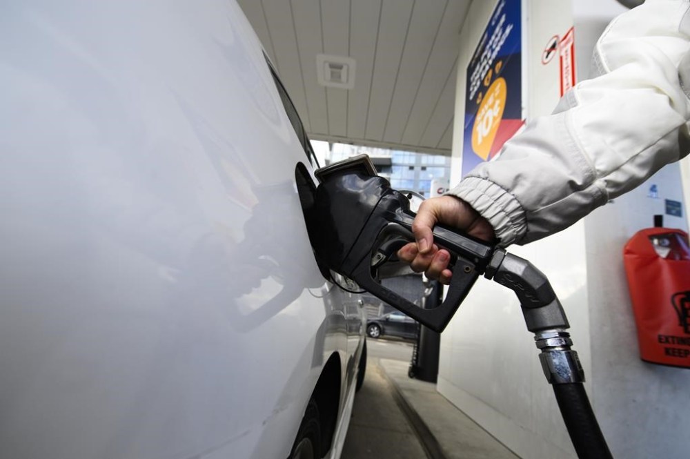 Fuel retailer Parkland Corp. says it posted a net loss of $5 million in its first quarter as its financial results took a hit due to an unplanned shutdown at its Burnaby refinery. A woman gasses up at a gas station in Mississauga, Ont., Tuesday, Feb. 13, 2024. THE CANADIAN PRESS/Christopher Katsarov