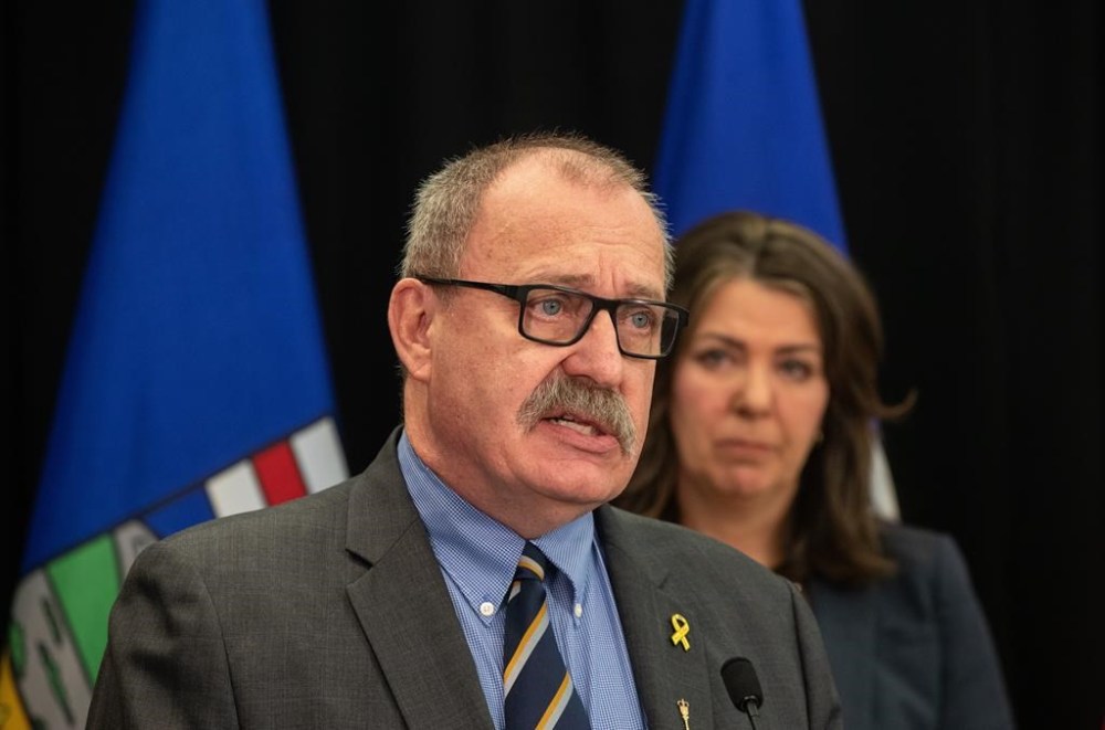 Minister of Municipal Affairs Ric McIver and Alberta Premier Danielle Smith take part in a press conference in Edmonton on Wednesday April 10, 2024. THE CANADIAN PRESS/Jason Franson