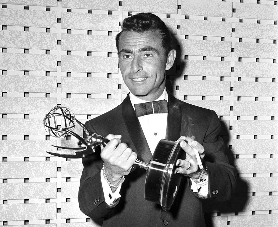 FILE - Writer Rod Serling holds the Emmy for best writing of a drama series for his work on