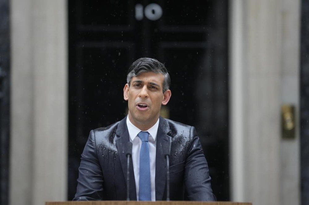 Britain's Prime Minister Rishi Sunak speaks to the media outside 10 Downing Street in London Wednesday, May 22, 2024, as he announces that he is to call a General Election for July 4. (AP Photo/Kin Cheung)