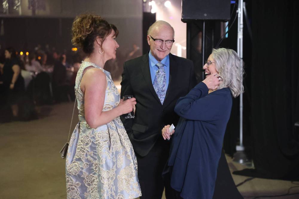 CW2 chief operating officer and partner Tanya LaBuick chats with business excellence award winners Frank and Joanne Nichols of The Paw Resort and Wellness Centre.