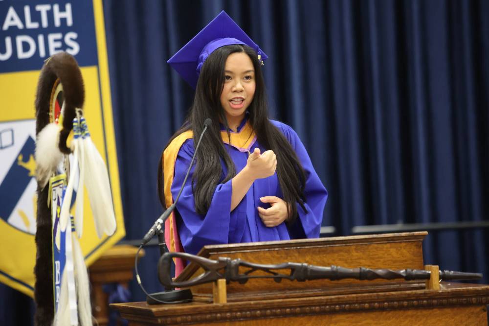 Faith Colobong, a graduate of the School of Music, gives her valedictory speech during Thursday morning’s convocation ceremony. (Abiola Odutola/The Brandon Sun)