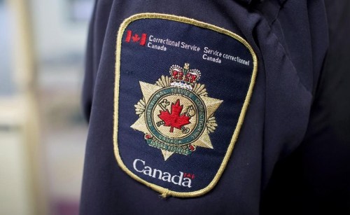 Correctional Service Canada confirms that the maximum-security Port-Cartier, Que. has been evacuated due to wilfires. Patches are seen on the arm and shoulder of a corrections officer during a media tour in Abbotsford, B.C., Thursday, Oct. 26, 2017. THE CANADIAN PRESS/Darryl Dyck