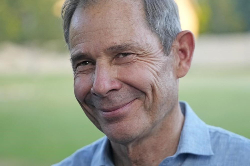 U.S. Rep. John Curtis speaks with reporters after his win during an election night party, Tuesday, June 25, 2024, in Provo, Utah. Curtis has won the Utah GOP primary for Mitt Romney's open U.S. Senate seat, defeating one opponent who was endorsed by former President Donald Trump and others who said they supported Trump's agenda. (AP Photo/Rick Bowmer)