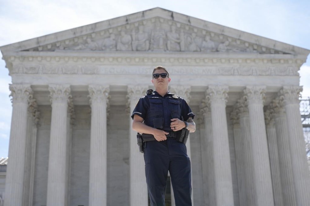 A Capitol Police officer stand guard during a protest outside of the U.S Supreme Court on Thursday, June 20, 2024, in Washington. (AP Photo/Mariam Zuhaib)