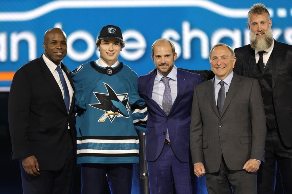 Macklin Celebrini, second from left, poses after being selected by San Jose Sharks during the first round of the NHL hockey draft Friday, June 28, 2024, in Las Vegas. THE CANADIAN PRESS/AP-Steve Marcus