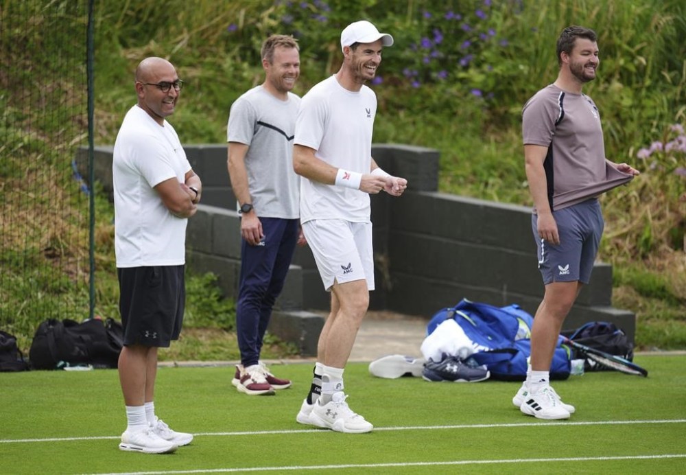 Britain's Andy Murray and his coaching team on the practice court at the All England Lawn Tennis and Croquet Club in Wimbledon, London, Saturday June 29, 2024. The Wimbledon Championships begin on July 1. (John Walton/PA via AP)