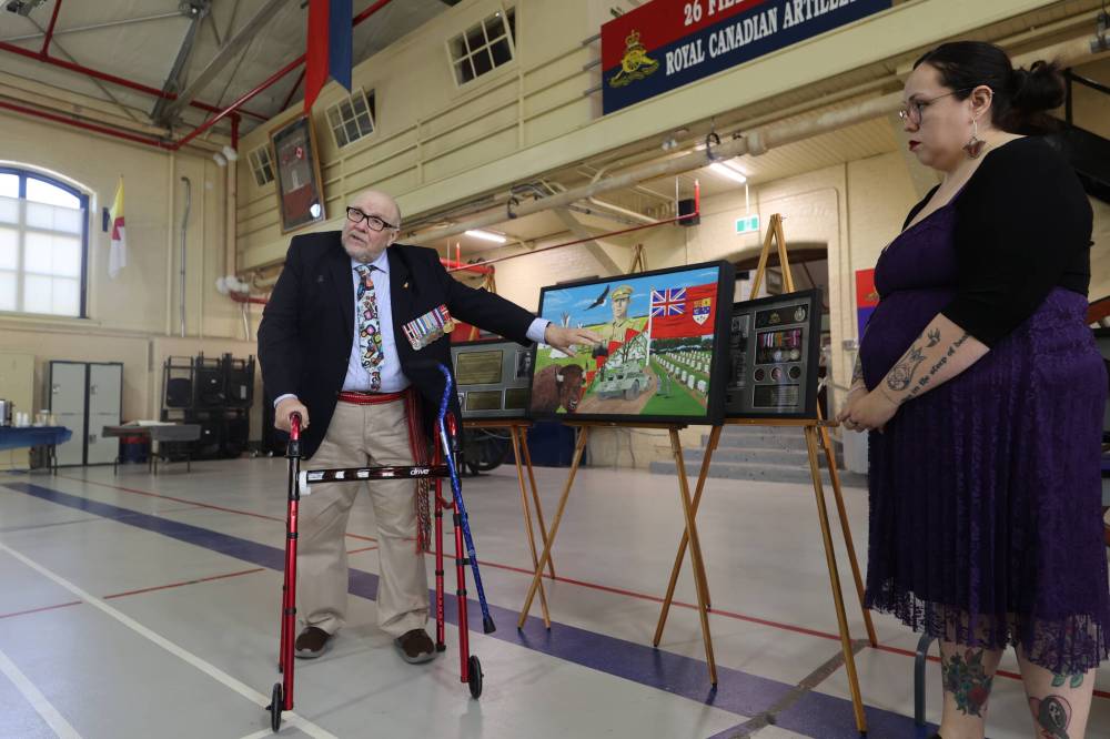 Twenty-sixth Field Regiment RCA/XII Manitoba Dragoons Museum curator Edd McArthur speaks to the audience after a new display highlighting the efforts of Indigenous soldiers is unveiled at a Saturday morning ceremony. (Geena Mortfield/The Brandon Sun)