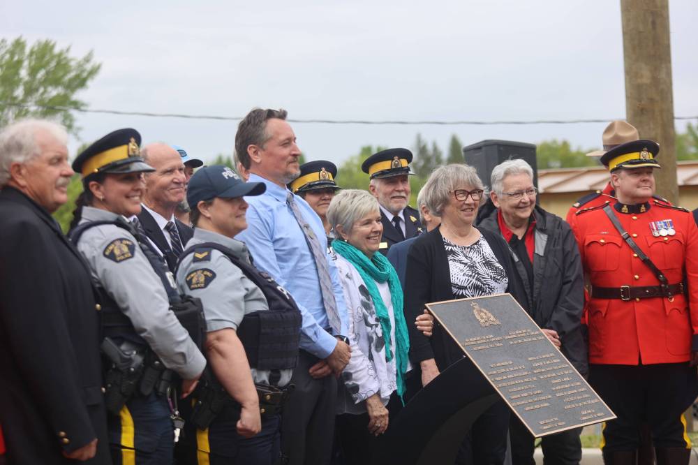 Family members of Constable Dennis A. Onofrey — his wife Paula and son Corey (middle) — travelled from Vancouver to attend a ceremony dedicating the Seventh Avenue bridge in Virden to the Mountie who was shot and killed in 1978. (Geena Mortfield/The Brandon Sun)