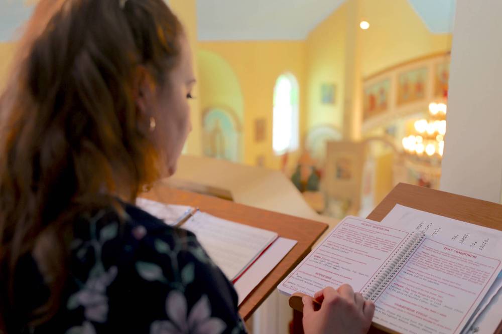 A choir member and her song book in Ukrainian are shown during a service Sunday afternoon that celebrated the 100th anniversary of the Ukrainian Orthodox Church of the Holy Ghost on the corner of Stickney Avenue and 11th Street North in Brandon. (Michele McDougall/The Brandon Sun)