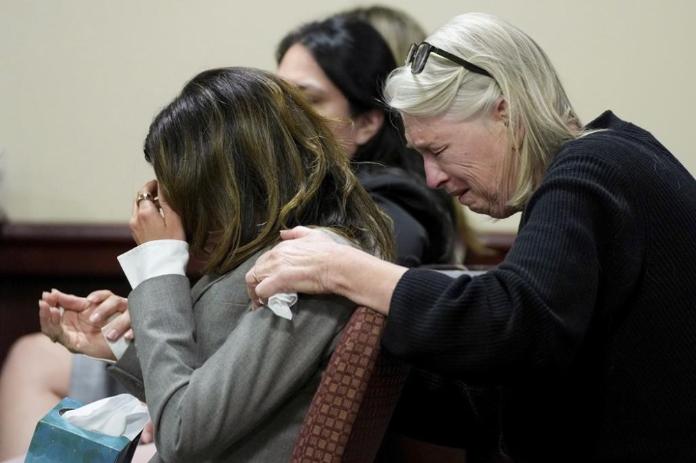 Hilaria Baldwin, left, wife of actor Alec Baldwin, and his sister Elizabeth Keuchler react during Alec Baldwin's trial for involuntary manslaughter for the 2021 fatal shooting of cinematographer Halyna Hutchins during filming of the Western movie