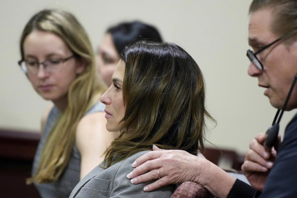 Hillaria Baldwin, wife of actor Alec Baldwin, and his brother Stephen Baldwin, right, react during Alec Baldwin's trial for involuntary manslaughter for the 2021 fatal shooting of cinematographer Halyna Hutchins during filming of the Western movie