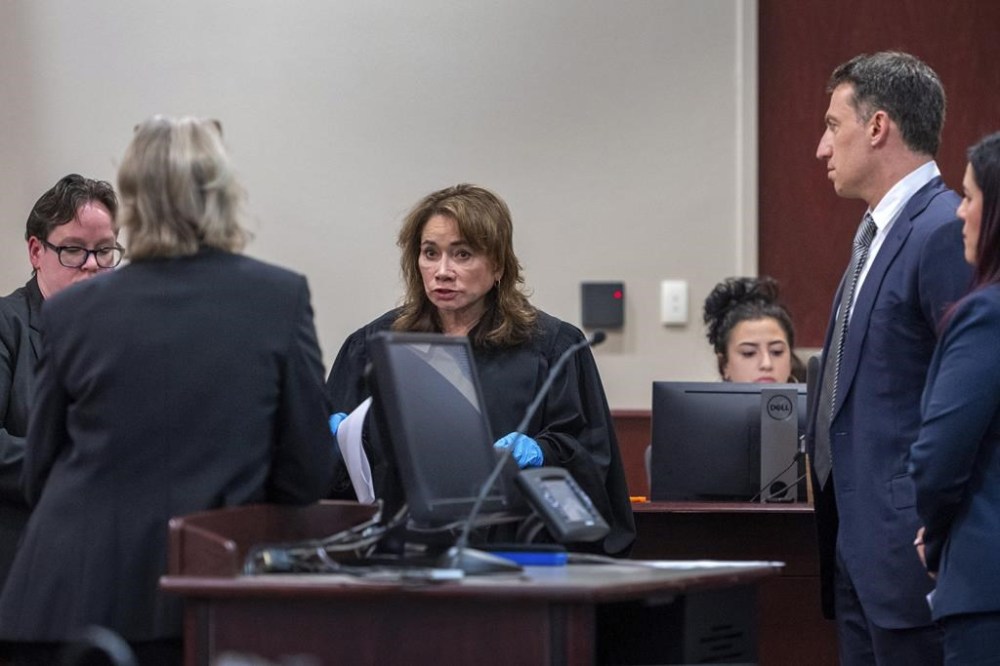 Judge Mary Marlowe Sommer, center, questions special prosecutor Kari Morrissey, second from left, about evidence not turned over to defense attorney Alex Spiro, second from right, during actor Alec Baldwin's trial for involuntary manslaughter for the 2021 fatal shooting of cinematographer Halyna Hutchins during filming of the Western movie