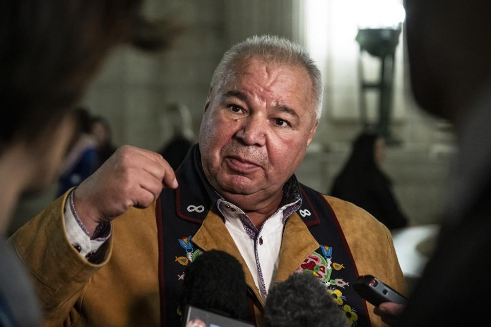 Manitoba Métis Federation President David Chartrand speaks to media after the throne speech at the Manitoba Legislative Building in Winnipeg, Tuesday, Nov. 21, 2023. The Manitoba Métis Federation is finalizing the purchase of two more office buildings and a parking lot in the heart of downtown Winnipeg. THE CANADIAN PRESS/Aaron Vincent Elkaim