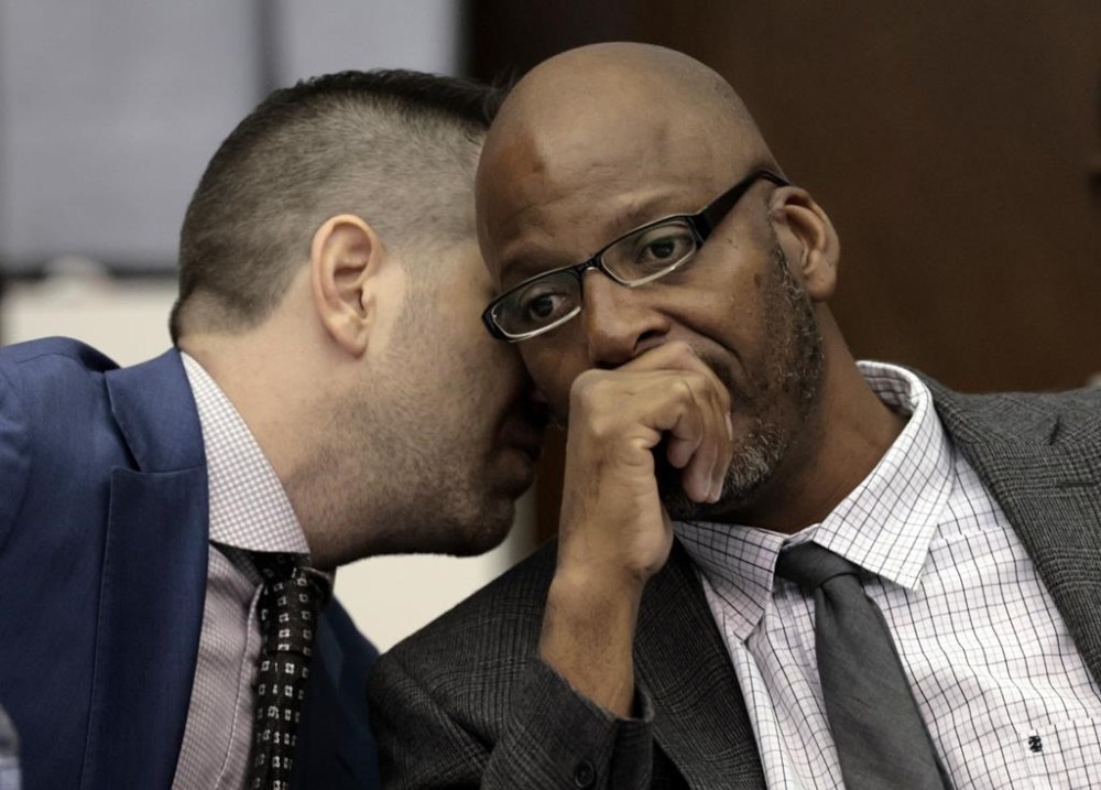 FILE - Christopher Dunn, right, listens to his attorney Justin Bonus from New York City during the first day of his hearing to decide whether to vacate his murder conviction, Tuesday, May 21, 2024, at the Carnahan Courthouse in St. Louis. A Missouri judge on Monday, July 24, 2024, overturned the conviction of Dunn, who has spent more than 30 years in prison for a killing he has long contended he didn’t commit. (Laurie Skrivan/St. Louis Post-Dispatch via AP, Pool, File)