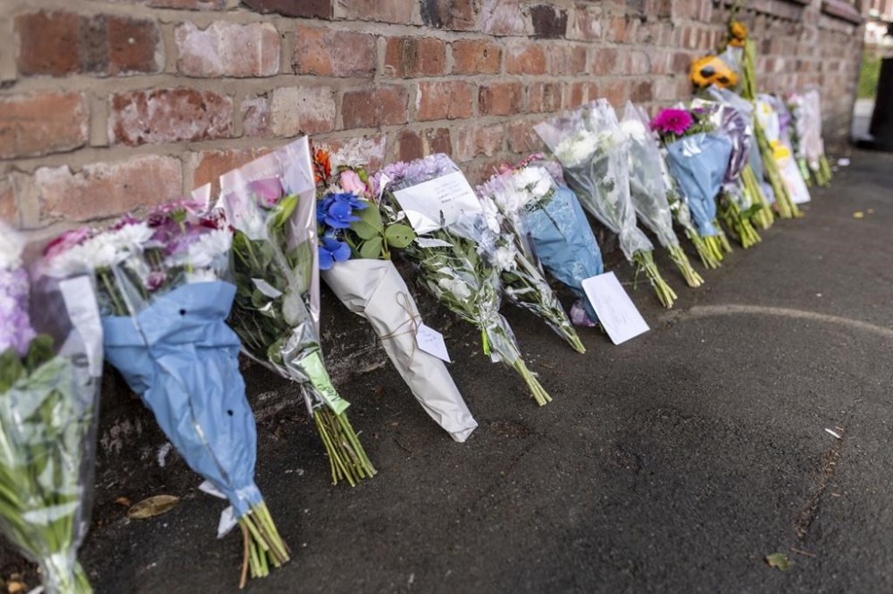 Floral tributes near the scene in Hart Street, Southport, Britain, Tuesday July 30, 2024, where two children died and nine were injured in a
