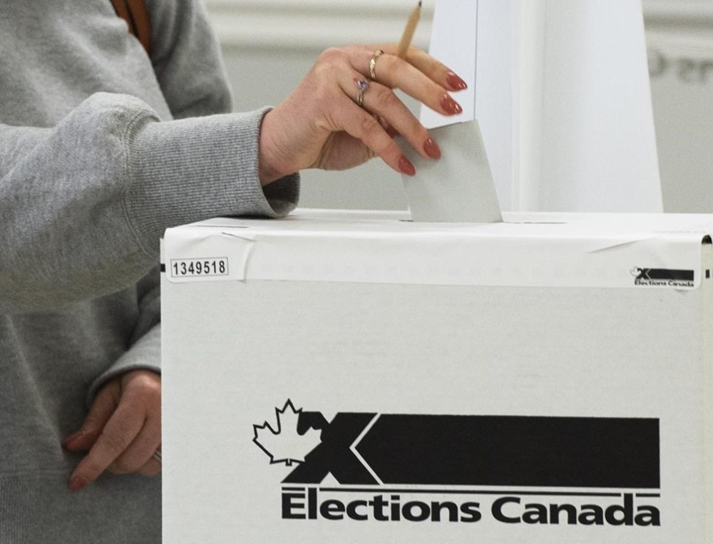 The Conservative candidate in a Manitoban federal byelection just got a boost from the vice-president of the International Brotherhood of Electrical Workers, a union representing more than 70,000 members in Canada. A voter casts their ballot in the advance polls, Friday, Sept. 10, 2021, in Chambly, Que. THE CANADIAN PRESS/Ryan Remiorz