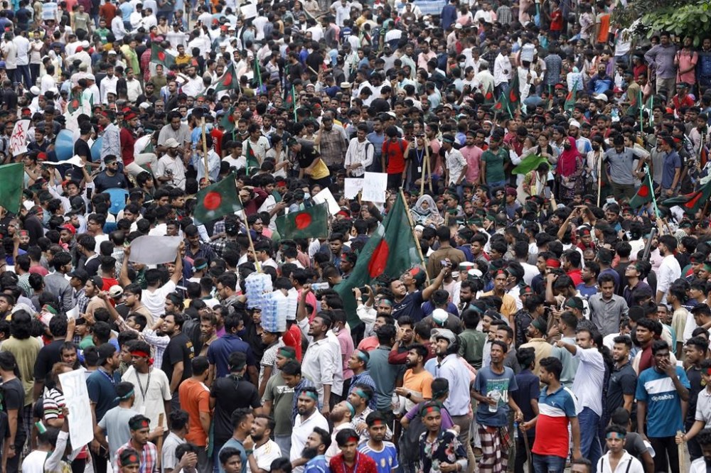 People participate in a rally against Prime Minister Sheikh Hasina and her government demanding justice for the victims killed in the recent countrywide deadly clashes, in Dhaka, Bangladesh, Sunday, Aug. 4, 2024. (AP Photo/Rajib Dhar)