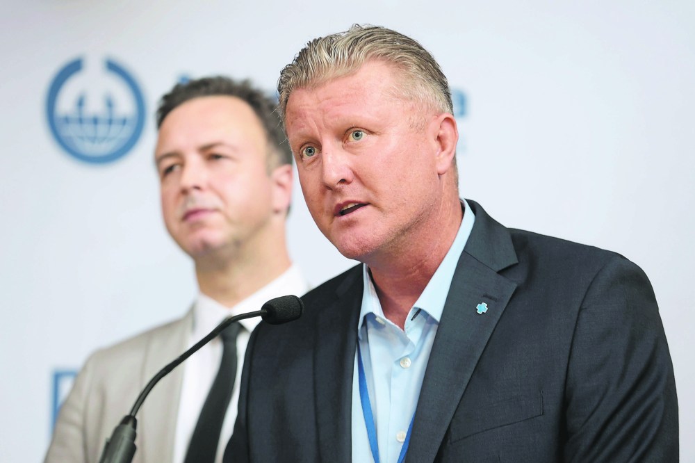 Provincial finance Minister Adrien Sala and Ben Graham, board chairman of Manitoba Hydro, in a file photo. Graham said he doesn’t know when the board will convene its next meeting in the North, calling the recent gathering a “one-off.” (File)