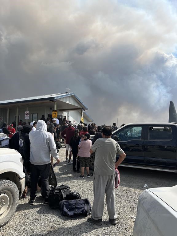 Residents of the Bunibonibee Cree Nation in Oxford House, Man. prepare to evacuate due to a nearby wildfire in an Aug. 13, 2024 handout photo. Some of the evacuees from that community have been staying in Brandon, but they are now planning to return as a fire near their home community has been contained. (File)
