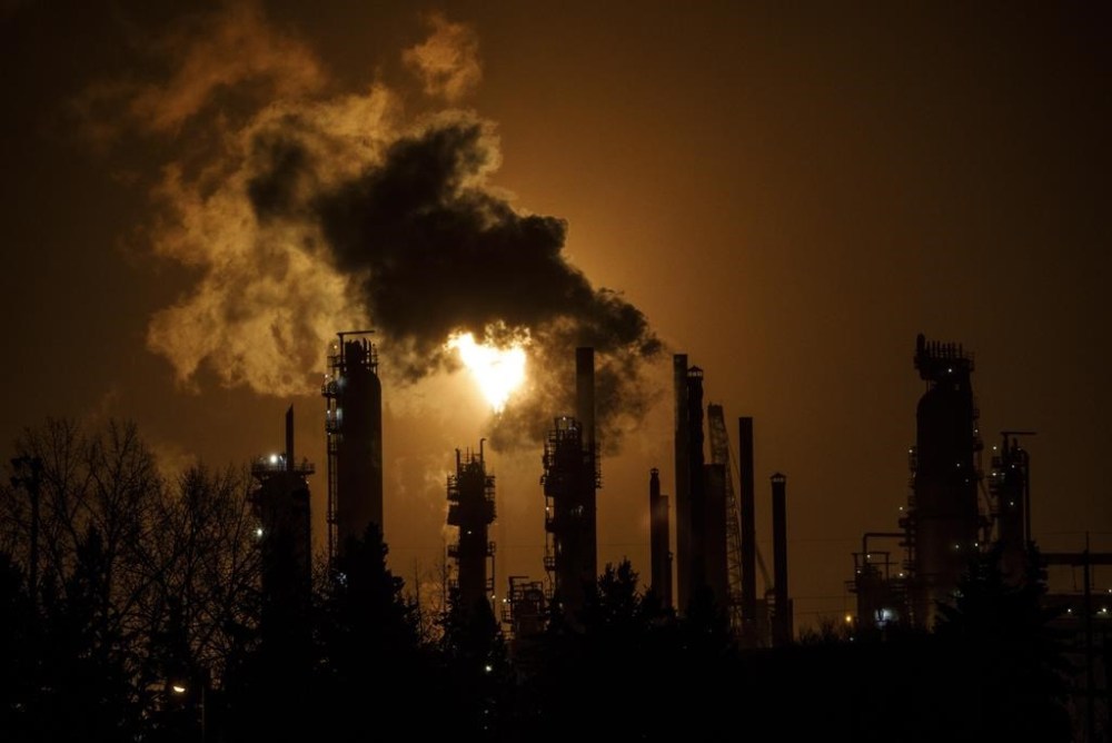 A flare stack lights the sky from the oil refinery in Edmonton on Friday December 28, 2018. THE CANADIAN PRESS/Jason Franson
