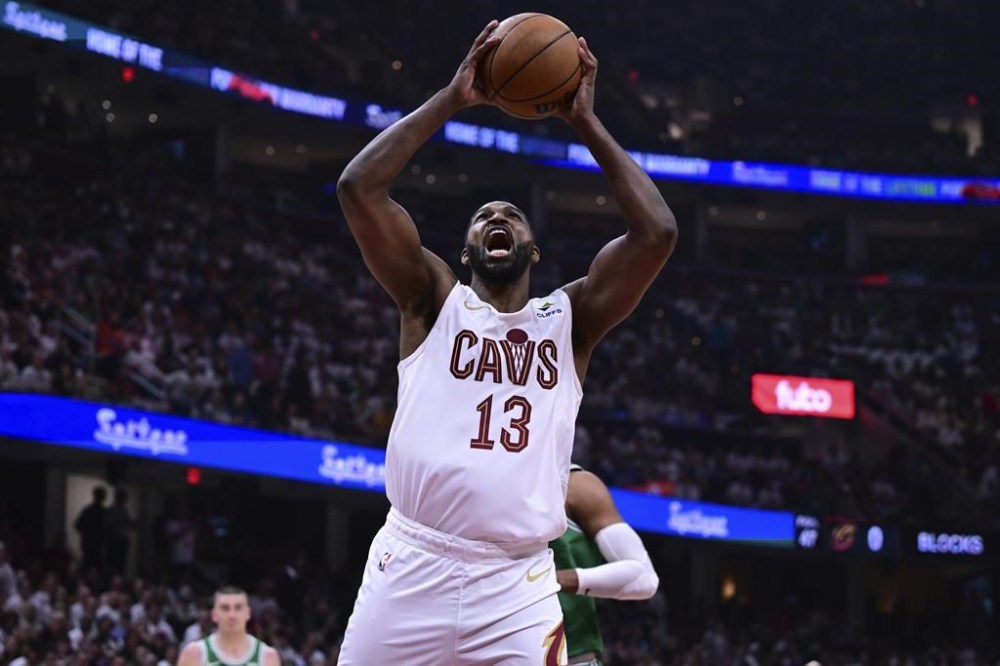 FILE - Cleveland Cavaliers center Tristan Thompson (13) goes up for a dunk during the first half of Game 4 of an NBA basketball second-round playoff series against the Boston Celtics, May 13, 2024, in Cleveland. (AP Photo/David Dermer, File)